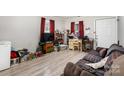 Living room with laminate floors and a TV at 1009 Spann St, Shelby, NC 28150