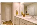 Bright bathroom featuring double sinks and tile floor at 1413 6Th Ne St, Hickory, NC 28601