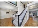 Two-story entryway with hardwood floors and elegant staircase at 1437 Autumn Ridge Ln, Fort Mill, SC 29708