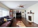 Spacious living room with hardwood floors, fireplace and large windows at 1804 Marlwood Cir, Charlotte, NC 28227