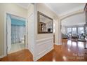 Bright entryway with hardwood floors, a view of the living room and bathroom at 2011 Vermount Way, Fort Mill, SC 29707