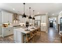 Modern kitchen with white cabinets, quartz countertops, and an island at 5100 Verona Rd # 96, Charlotte, NC 28213