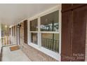 Front porch view with new windows and shutters at 1975 W Wall St, Wadesboro, NC 28170