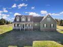 Two story house with green siding, white columns, and a large front yard at 3798 Red Doc Rd, Lancaster, SC 29720