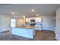 Modern kitchen with white cabinets and granite countertops at 589 N Sparkleberry St, Chester, SC 29706