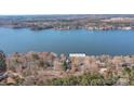 Aerial view showcasing lakefront home location and surrounding area at 638 Deerfield Rd, Mount Gilead, NC 27306