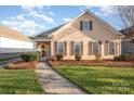 Ranch style home with neat landscaping and walkway at 10105 Bishops Gate Blvd, Pineville, NC 28134