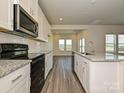 Modern kitchen with granite countertops and stainless steel appliances at 1271 31St Ne St, Conover, NC 28613