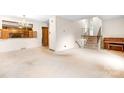 Spacious living room with staircase and piano at 5006 Hoyt Ct, Charlotte, NC 28210