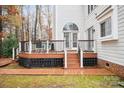 Spacious deck with stairs, railings, and ample space for outdoor furniture at 7681 Orchard Park Cir, Harrisburg, NC 28075