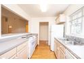 Bright kitchen with light cabinets, gray countertops, and stainless steel appliances at 407 19Th Ave Ne Ct, Hickory, NC 28601