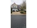 Two-story home with a three-car garage and driveway at 6334 Dillard Ridge Dr, Charlotte, NC 28216