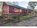 Red metal sided house with a fenced yard at 1115 Marys Grove Church Rd # 1, Kings Mountain, NC 28086
