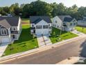 Several new construction homes with driveways at 630 Smith St # B, Mooresville, NC 28115
