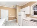 White kitchen with appliances and access to other rooms at 9315 Meadow Vista Rd, Charlotte, NC 28213