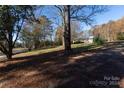 Ranch home nestled among mature trees on a spacious lot at 1022 Harper Keefe Rd, Indian Land, SC 29707