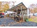 View of the home's exterior showcasing the covered porch at 108 Fathom Trl # 178, Mount Gilead, NC 27306