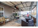 Covered porch with ceiling fans and outdoor seating at 108 Fathom Trl # 178, Mount Gilead, NC 27306