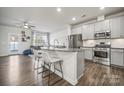 Modern kitchen with stainless steel appliances and an island at 12936 Canton Side Ave, Charlotte, NC 28273