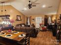 Bright living room featuring hardwood floors, a dining area, and ample natural light at 1663 Golden Cedar Ln, Newton, NC 28658