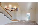 Bright entryway with staircase and hardwood flooring at 7031 Walton Heath Ln, Charlotte, NC 28277