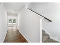 Bright hallway with hardwood floors and staircase leading upstairs at 1009 20Th Avenue Se Loop, Hickory, NC 28602