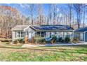 House exterior showcasing a single-story home with a detached garage at 357 Stillwater Rd, Troutman, NC 28166