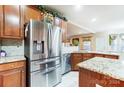Stainless steel appliances and granite countertops in this lovely kitchen at 417 Stowe Rd, Belmont, NC 28012