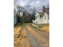 Gravel driveway leading to the house at 605 E Graham St, Shelby, NC 28150