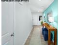 Bright and spacious hallway with wood-look floors and decorative console table at 875 Two Brothers Ln, York, SC 29745