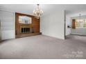 Bright living room featuring a fireplace and built-in shelving at 2319 Tin Mine Rd, Lincolnton, NC 28092