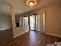 Light-filled dining area with hardwood floors and access to balcony at 11105 Harrowfield Rd, Charlotte, NC 28226