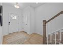 Light and bright entryway with wood-look floors and a staircase at 13009 Moon Rd # 42, Charlotte, NC 28277