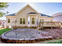 Large backyard with a deck and gravel patio at 131 Quail Haven Dr, Troutman, NC 28166