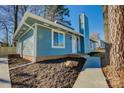 Newly renovated blue house with brick accents and walkway at 2515 Dion Ave, Charlotte, NC 28212