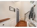 Entryway with gray door, hardwood floors, and coat hooks at 7422 Henderson Park Rd, Huntersville, NC 28078