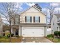 Attractive two-story residence featuring a two-car garage and a concrete driveway at 4812 Gibbons Link Rd, Charlotte, NC 28269