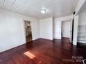 Spacious bedroom with hardwood floors and access to other rooms at 703 Buffalo St, Shelby, NC 28150