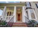 Two story home with a red door and brick steps leading to the porch at 7750 Trailridge Dr, Tega Cay, SC 29708