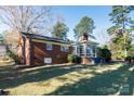Brick home with sunroom and spacious backyard at 829 Rawlinson Rd, Rock Hill, SC 29732