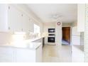 Bright kitchen with white cabinets and appliances at 829 Rawlinson Rd, Rock Hill, SC 29732
