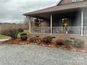 Home exterior showcasing a charming covered porch at 158 White Rd, Wadesboro, NC 28170