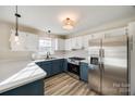 Kitchen with stainless steel appliances and blue cabinets at 2030 Fairhope Rd, York, SC 29745