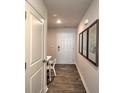 Bright foyer with wood-look floors and coat closet at 5141 Hyrule Dr, Charlotte, NC 28262