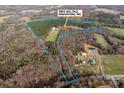 Large lot with wooded acreage and a home, offering privacy and potential at 7812 Hwy 742 Hwy, Marshville, NC 28103