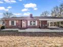 Brick ranch home with carport and mature trees at 1586 Kings Rd, Shelby, NC 28150