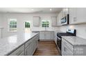 Modern kitchen featuring granite countertops and stainless steel appliances at 185 Giant Oak Ave, Statesville, NC 28677