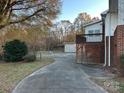 Backyard with a fenced area and a small wooden deck at 915 37Th Sw St, Hickory, NC 28602