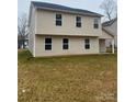 Back exterior view of a two-story home with a small backyard at 1305 Dodd St, Shelby, NC 28152