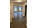 Hallway with wood-look flooring leading to an open living area at 1305 Dodd St, Shelby, NC 28152